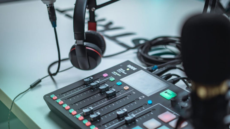 Professional podcast recording setup with a microphone and mixer.