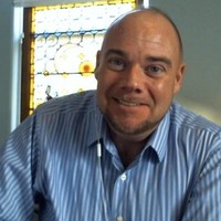 Headshot of Jason Topel.