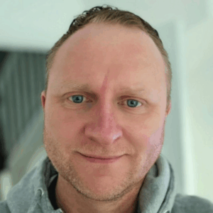 Headshot of James Descombes.